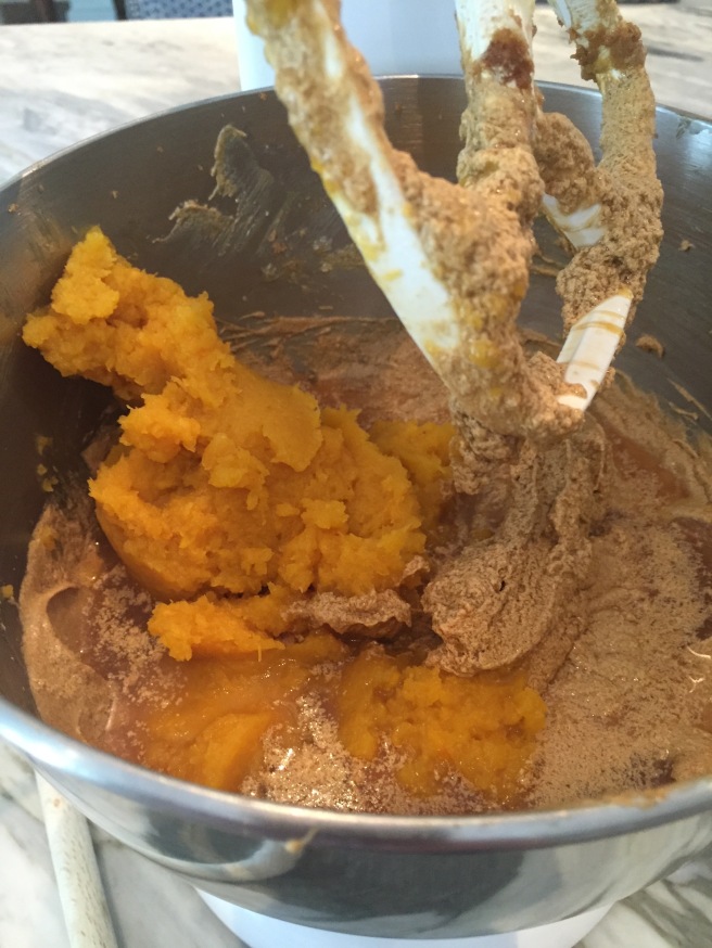 Adding the pumpkin purée and cider to butter, sugar, and egg mixture.