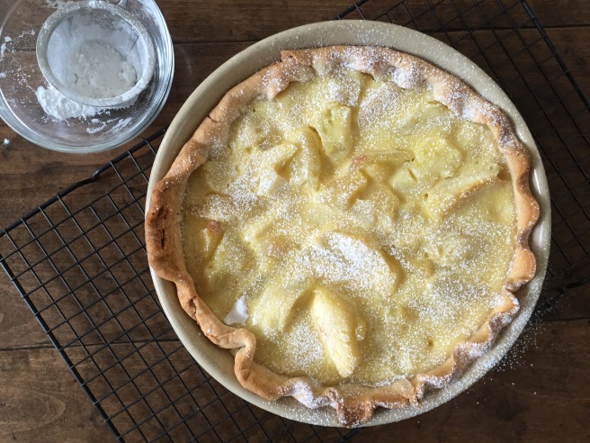 Apple Cream Pie dusted with powdered sugar.
