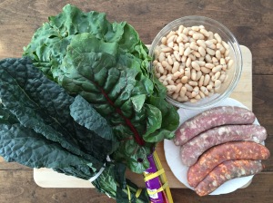 Raw sausage, bunch of kale, bunch of chard, cannellini beans