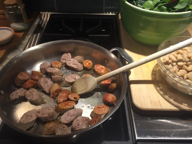 Sautéing sausage on cooktop