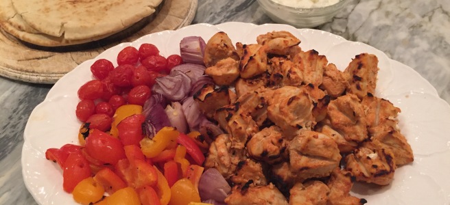 Platter of shish taouk with grilled peppers, onions, and tomatoes