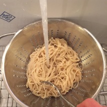 Rinse and drain noodles in colander, separating strands with a fork