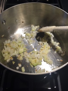 Sauté smashed garlic in saucepan