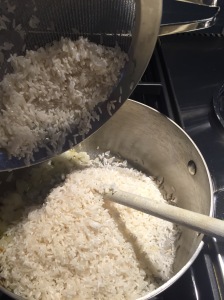 Adding rice to saucepan