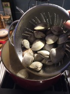 Adding clams to boiling water